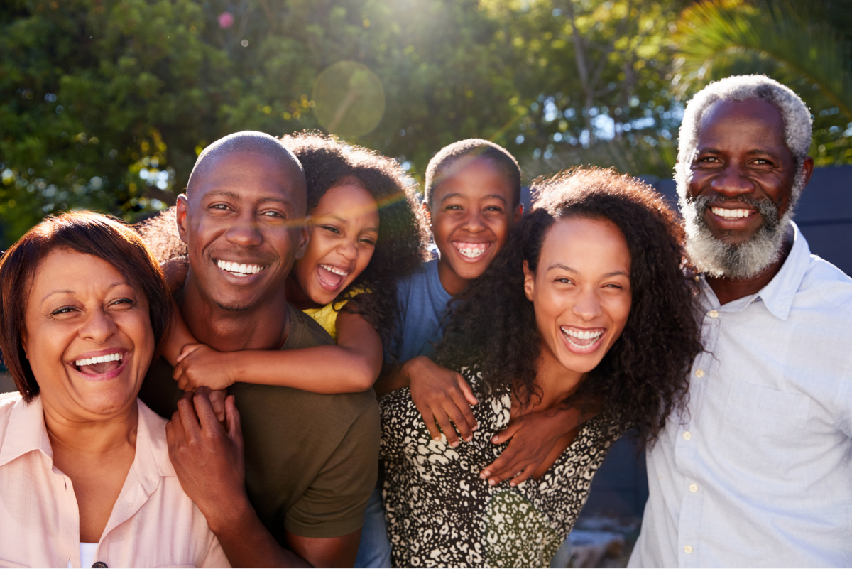 Family smiling together with healthy teeth