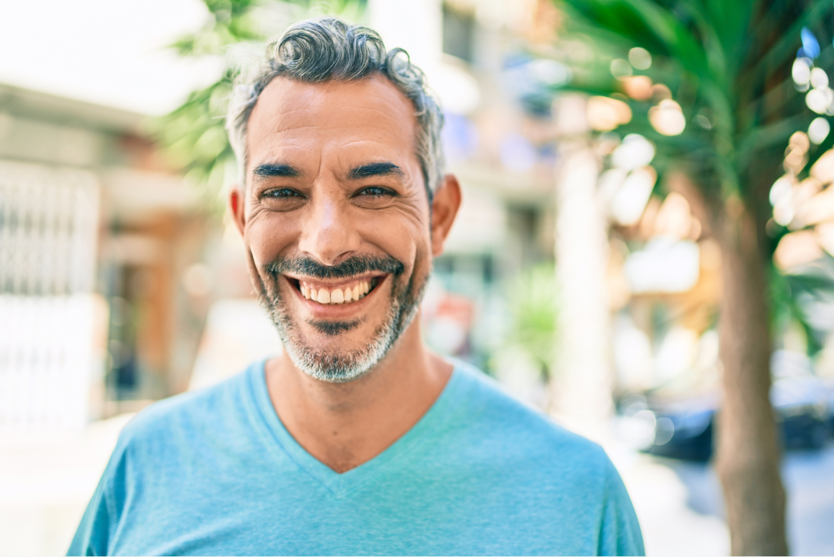 Man with a confident smile after orthodontic treatment