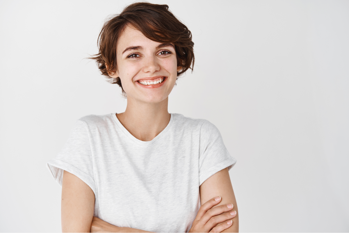 Confident woman showing her smile after orthodontic care